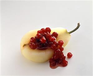 Pear half stuffed with cranberries