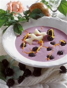 Cold blackberry soup with pear slices