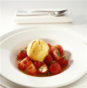 Strawberries with orange ice cream in Grand Marnier sauce