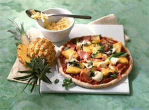 Pizza with ham and pineapple