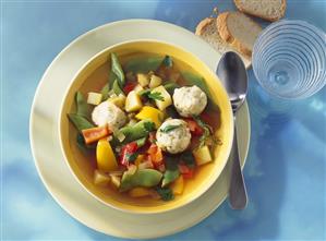 Colourful vegetable stew with herb dumplings