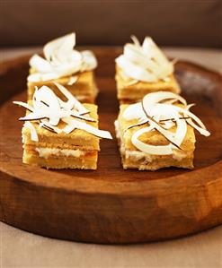 Coconut slices on a wooden tray