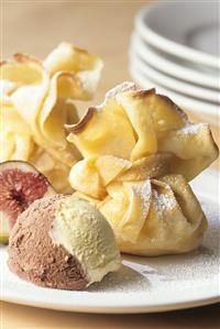 Crepe pouches filled with figs, with scoop of ice cream