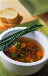 Clear vegetable soup with chives