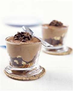 Chocolate mousse with coffee beans in a glass