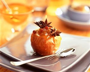 Baked apple with jam filling and star anise