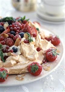 Meringue tart with cream and mixed berries