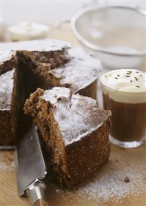 Chocolate cake with icing sugar, pieces cut