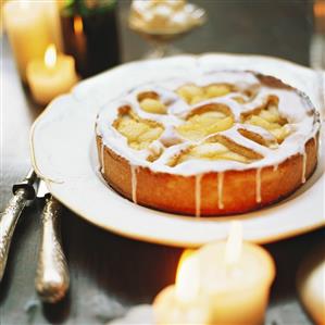 Iced apple cake; decoration: burning candles