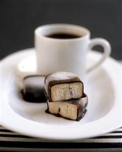 A cup of coffee with pralines