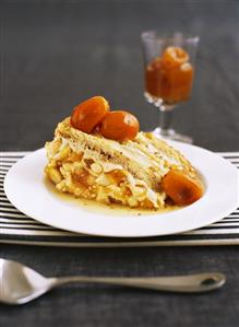 A piece of sponge gateau with candied kumquats