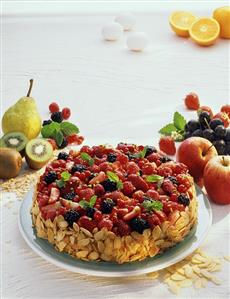 Fruity berry gateau with flaked almonds