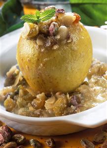 Baked apple with raisins, pistachios and almonds