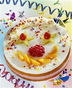 Clown cake with fruit and coloured sprinkles for children