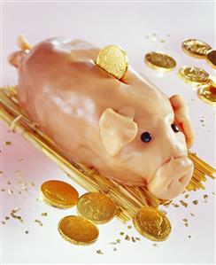 Piggy bank with chocolate pennies for children