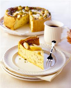 Pear cheesecake (cake with piece cut and piece of cake)