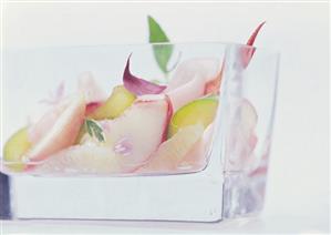 Savoury fruit salad with lobster in glass container