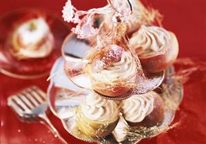 Baked apples, filled with vanilla, on tiered stand