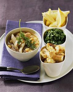 Chicken soup with chick-peas, flatbread, herbs, lemon