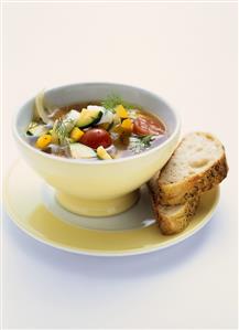 Vegetable soup with courgettes, peppers and cherry tomatoes