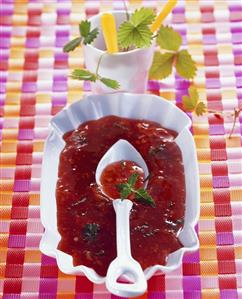 Strawberry and melon jam in small bowl