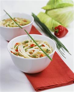 White cabbage soup with peppers and chives