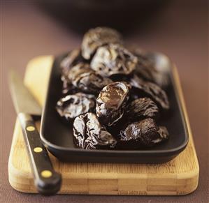 Prunes in brown bowl