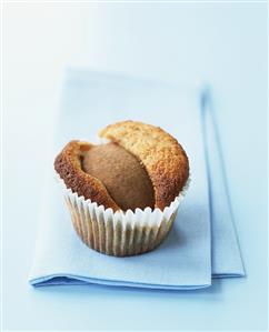 Peach muffin on pale-blue napkin