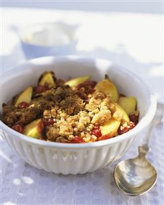 Peach crumble in white baking dish