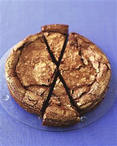 Chocolate cake with gold leaf, slices cut