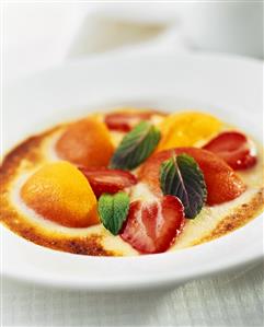 Poached peaches and strawberries in vanilla cream