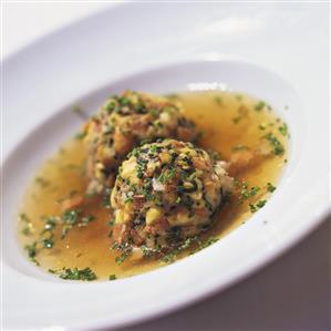 Clear broth with bacon dumplings and chives