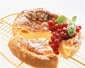 Kefir cake with redcurrants and icing sugar