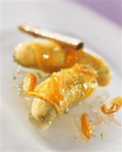 Turmeric crepes with bananas, kumquats and honey sauce