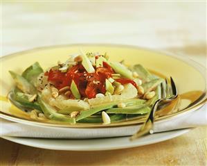 Avocado salad with grapefruit, peppers and pine nuts