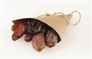 Dried dates in paper bag