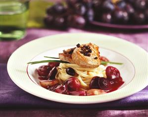 Pork medallions on ribbon pasta with grape sauce