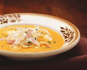 Apple and carrot soup with ham and horseradish