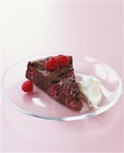 Piece of chocolate raspberry cake with cream (gluten-free)