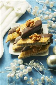 Walnut diamonds, half coated in chocolate, for Christmas