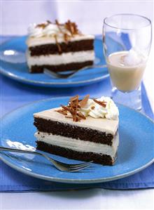 Piece of Baileys cake with cream and grated chocolate