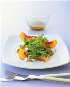 Savoury peach salad with goat's cheese, rocket and hazelnuts