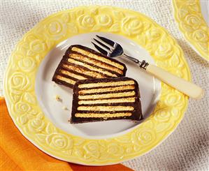 Two pieces of "Cold dog cake" (made from biscuits & chocolate)