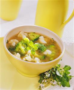 Cauliflower soup with broccoli and fresh herbs