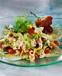 Pasta salad with chicken, vegetables and grapes