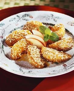 Caramelised apple wedges with sesame cooked in wok