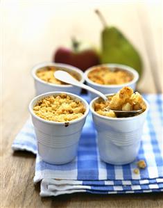 Apple and pear crumble in small beakers