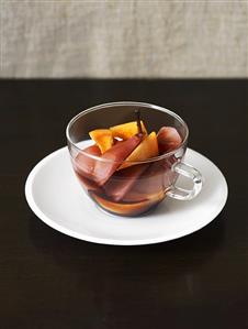 Pear and melon compote in glass cup