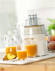 Peach juice with electric juicer