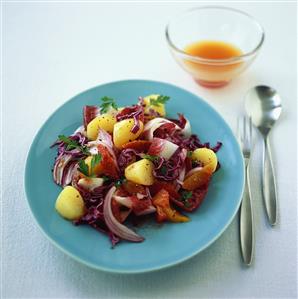 Warm red cabbage salad with potatoes and oranges